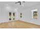 Spacious bedroom with hardwood floors, vaulted ceiling and French doors at 155 Pearl St, Auburndale, FL 33823