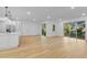 Spacious living area with hardwood floors and access to backyard at 155 Pearl St, Auburndale, FL 33823