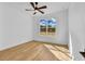 Bright bedroom with hardwood floors and large window at 155 Pearl St, Auburndale, FL 33823