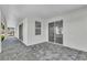 Spacious back patio with paver stones and access to the interior at 155 Pearl St, Auburndale, FL 33823