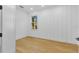 Spacious bedroom with hardwood floors and white walls at 155 Pearl St, Auburndale, FL 33823