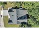 Top-down view of a house with a gray asphalt roof and dormers at 155 Pearl St, Auburndale, FL 33823
