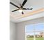 Bedroom with ceiling fan and window with a view at 1877 Snapper Dr, Kissimmee, FL 34759