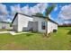 Modern home exterior showcasing landscaping and a side view of the house at 1877 Snapper Dr, Kissimmee, FL 34759