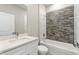 Modern bathroom with white cabinets and tile shower at 1877 Snapper Dr, Kissimmee, FL 34759