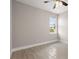 Spacious bedroom with window and ceiling fan at 1877 Snapper Dr, Kissimmee, FL 34759