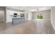 Modern kitchen with white shaker cabinets, gray island, and stainless steel appliances at 1877 Snapper Dr, Kissimmee, FL 34759