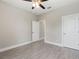 Bright bedroom with ceiling fan and tile floors at 1877 Snapper Dr, Kissimmee, FL 34759