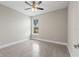 Spacious bedroom with large window and ceiling fan at 1877 Snapper Dr, Kissimmee, FL 34759