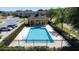 Community pool with a covered patio area at 2048 Cypress Bay Blvd, Kissimmee, FL 34743