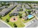 Aerial view showcasing community amenities, including a pool and playground at 2048 Cypress Bay Blvd, Kissimmee, FL 34743