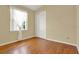 Bright bedroom featuring hardwood floors and a closet at 2108 Drive Way, Kissimmee, FL 34746