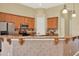 Kitchen with granite countertops and wood cabinets at 2108 Drive Way, Kissimmee, FL 34746