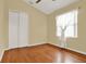 Hardwood floor bedroom with a closet and window at 2108 Drive Way, Kissimmee, FL 34746