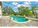 Inviting screened pool with fountain and patio at 2108 Drive Way, Kissimmee, FL 34746