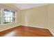 Bright home office with hardwood floors and a large window at 2108 Drive Way, Kissimmee, FL 34746