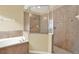 Bathroom with shower and separate tub at 2108 Drive Way, Kissimmee, FL 34746