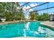 Inviting screened pool with fountain and patio at 2108 Drive Way, Kissimmee, FL 34746