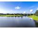 Peaceful golf course landscape with a lake at 2108 Drive Way, Kissimmee, FL 34746