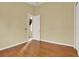 Bedroom with hardwood floors and access to another room at 2108 Drive Way, Kissimmee, FL 34746