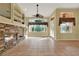 Living room with fireplace and tile flooring, open to kitchen at 2108 Drive Way, Kissimmee, FL 34746