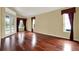 Living room with hardwood floors and large windows at 2108 Drive Way, Kissimmee, FL 34746