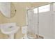 Clean bathroom with shower, toilet and pedestal sink at 2108 Drive Way, Kissimmee, FL 34746
