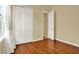 Bedroom with wood flooring, double closet and access to bathroom at 2108 Drive Way, Kissimmee, FL 34746