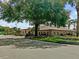 Community clubhouse with parking and landscaping at 21523 Queen Anne Ct, Leesburg, FL 34748