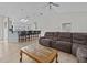Open kitchen with breakfast bar and view into the living room at 21523 Queen Anne Ct, Leesburg, FL 34748
