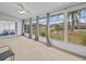 Screened porch with view of backyard and access to bedroom at 21523 Queen Anne Ct, Leesburg, FL 34748