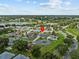 Aerial view showcasing a single-story house nestled in a tranquil community at 21523 Queen Anne Ct, Leesburg, FL 34748