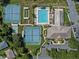Community pool, tennis courts, and clubhouse at 21523 Queen Anne Ct, Leesburg, FL 34748
