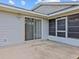Private patio adjacent to the screened porch at 21523 Queen Anne Ct, Leesburg, FL 34748