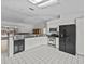 Spacious kitchen featuring granite countertops and stainless steel appliances at 21523 Queen Anne Ct, Leesburg, FL 34748