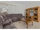 Relaxing living room with sectional sofa, coffee table, and built-in shelving at 21523 Queen Anne Ct, Leesburg, FL 34748