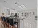 Modern kitchen with granite countertops and black appliances at 21523 Queen Anne Ct, Leesburg, FL 34748