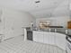 Modern kitchen with granite countertops and stainless steel appliances at 21523 Queen Anne Ct, Leesburg, FL 34748