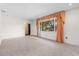 Living room with large window and view of the street at 2900 Lake Arnold Pl, Orlando, FL 32806