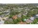 Aerial view of neighborhood featuring houses, trees and a body of water at 2900 Lake Arnold Pl, Orlando, FL 32806