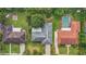 Aerial view of three homes with varying roof styles and spacious yards at 2900 Lake Arnold Pl, Orlando, FL 32806