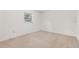 Simple bedroom with carpeted floors and a window at 2900 Lake Arnold Pl, Orlando, FL 32806