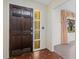 Entryway with dark wood door and patterned tile floor at 2900 Lake Arnold Pl, Orlando, FL 32806