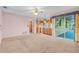 Living area with kitchen and sliding glass doors to patio at 2900 Lake Arnold Pl, Orlando, FL 32806