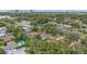 Neighborhood view showcasing a home with a pool, near a city skyline at 2900 Lake Arnold Pl, Orlando, FL 32806