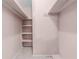 Walk-in closet with hanging rods and shelving at 2900 Lake Arnold Pl, Orlando, FL 32806