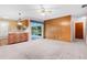 Bright living room with brick accent wall and view of backyard patio at 2900 Lake Arnold Pl, Orlando, FL 32806