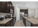 Spacious kitchen with stainless steel appliances and granite countertops at 365 Southfield St, Kissimmee, FL 34747