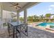 Private patio with outdoor dining and pool access at 365 Southfield St, Kissimmee, FL 34747