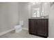 Simple bathroom with granite vanity and toilet at 365 Southfield St, Kissimmee, FL 34747